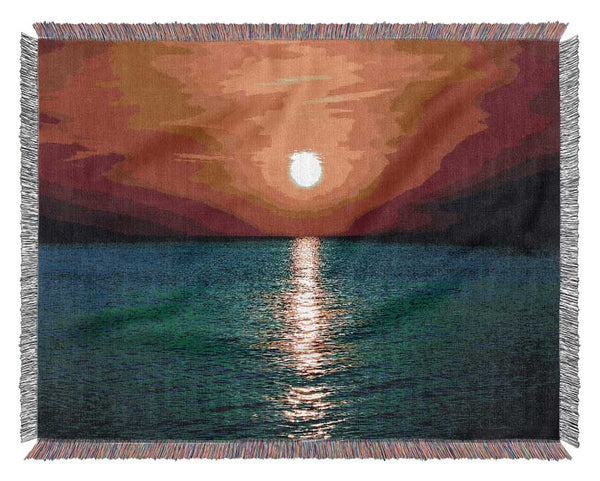 As The Sun Goes Down Over The Turquoise Ocean Woven Blanket