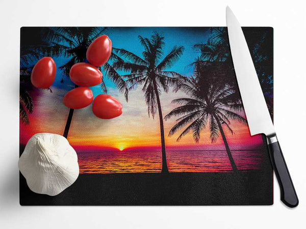 As The Sun Goes Down Between The Palm Trees Glass Chopping Board