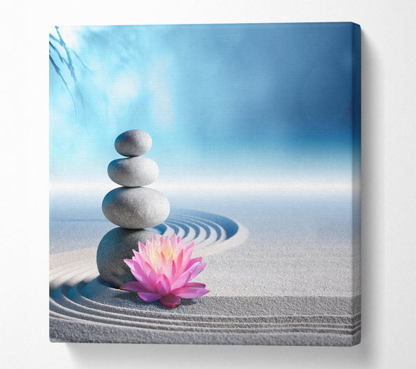 A Square Canvas Print Showing pebbles on zen beach lilly Square Wall Art