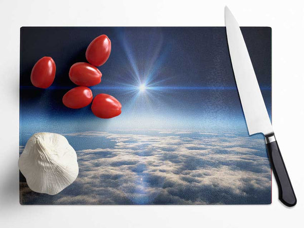 The sun above the clouds and atmostphere Glass Chopping Board