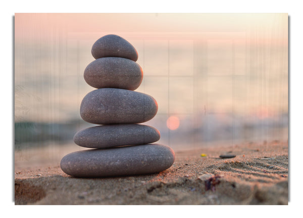 Zen stones stacked up on beach
