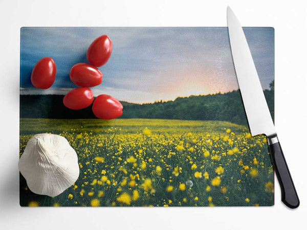 Surreal field of yellow flowers Glass Chopping Board