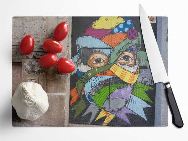 Wrapped up face art Glass Chopping Board