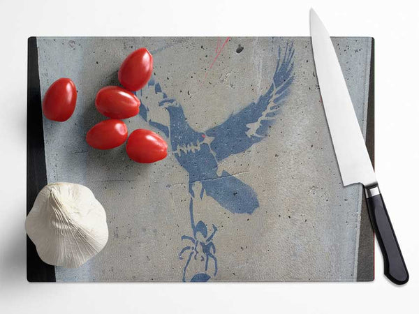 Dove taking off with spider Glass Chopping Board