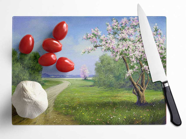 The Road Through The Blossom Glass Chopping Board