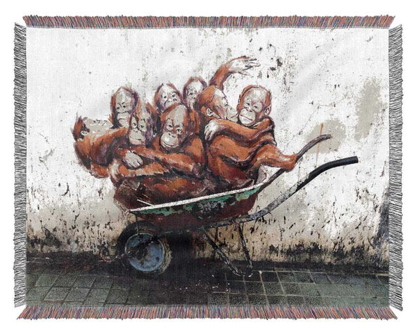 Orangutans In A Wheelbarrow Woven Blanket