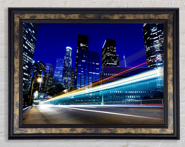 Speedway Through The City Framed Print