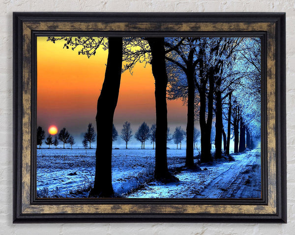 Winter Landscape With Orange Sky Framed Print