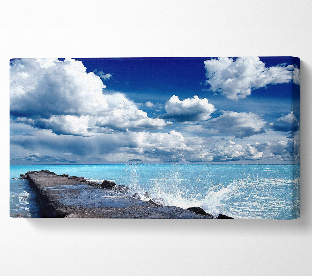  A Canvas Print of Gentle Waves Crashing In The Cloud Filled Sky Canvas Wall Art
