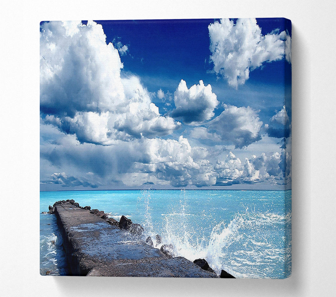  A Canvas Print of Gentle Waves Crashing In The Cloud Filled Sky Canvas Wall Art