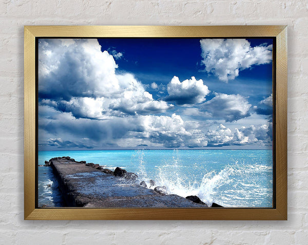 Gentle Waves Crashing In The Cloud Filled Sky Framed Print