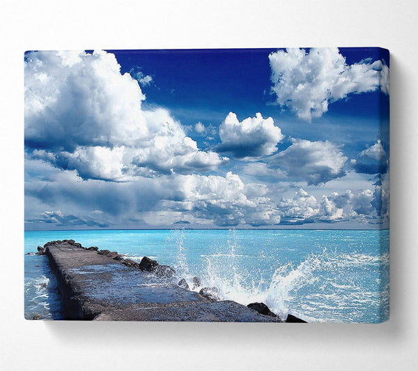  A Canvas Print of Gentle Waves Crashing In The Cloud Filled Sky Canvas Wall Art