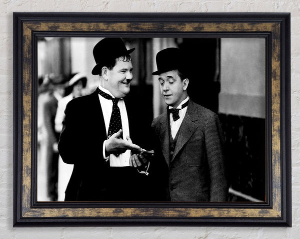 Laurel And Hardy Money Framed Print