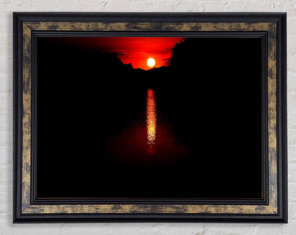 As The Stunning Red Sun Goes Down Framed Print