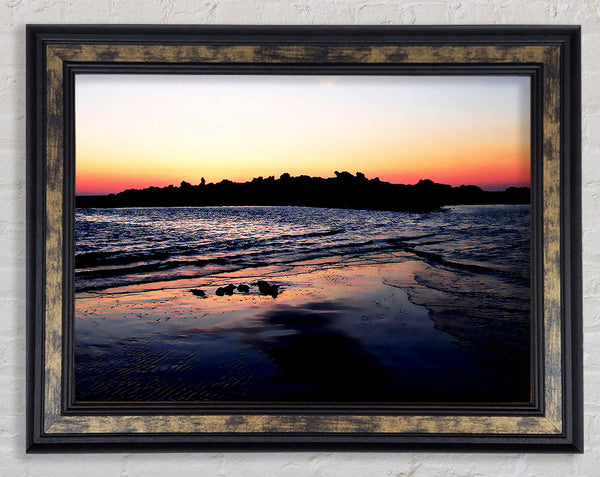 Sunset Behind The Ocean Rocks Framed Print