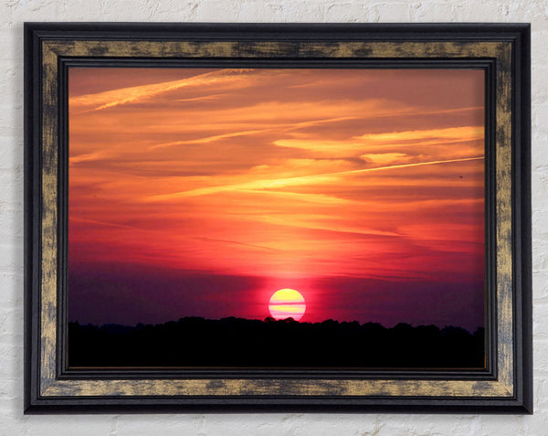 Clouds Across The Setting Sun Framed Print