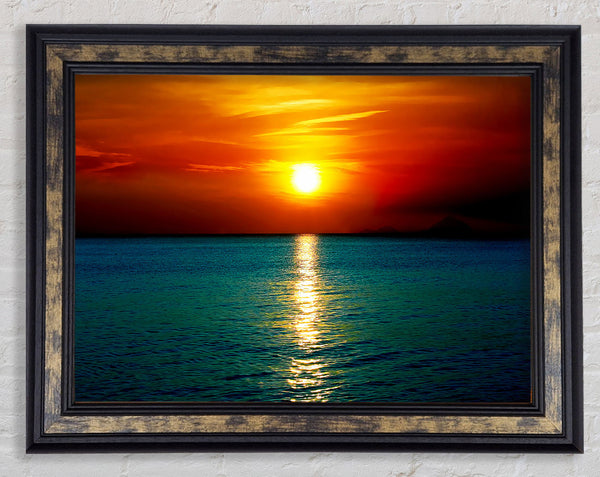 As The Sun Goes Down Over The Turquoise Ocean Framed Print