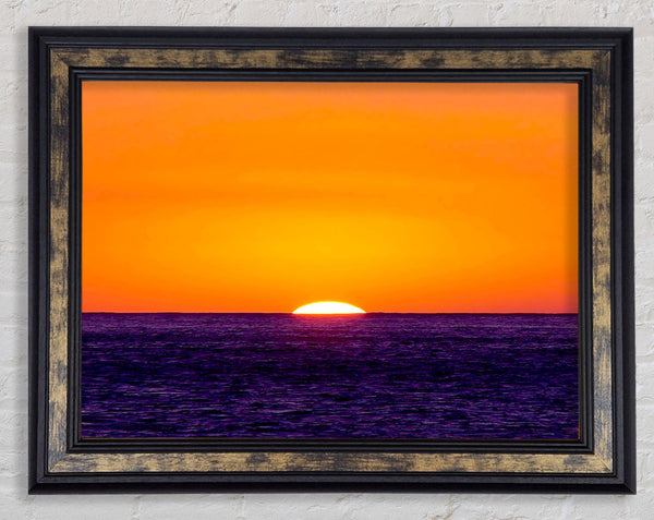 As The Sun Goes Down Over The Ocean Orange Framed Print
