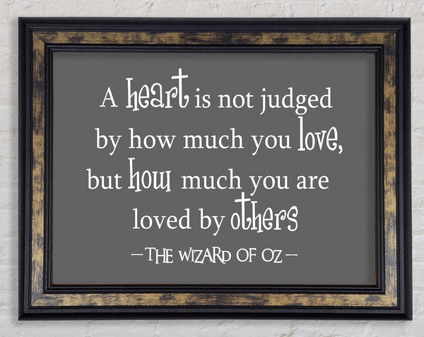 Movie Quote Wizard Of Oz A Heart Is Not Judged Grey Framed Print