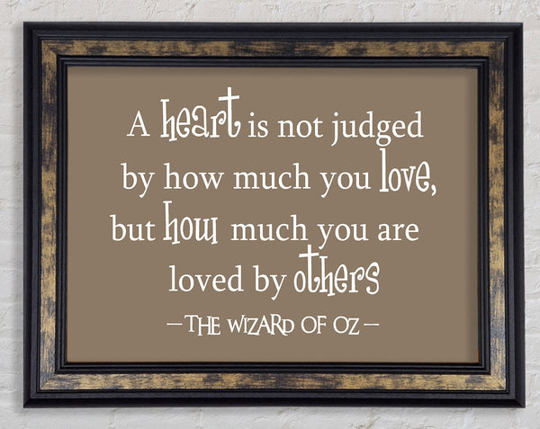 Movie Quote Wizard Of Oz A Heart Is Not Judged Beige Framed Print