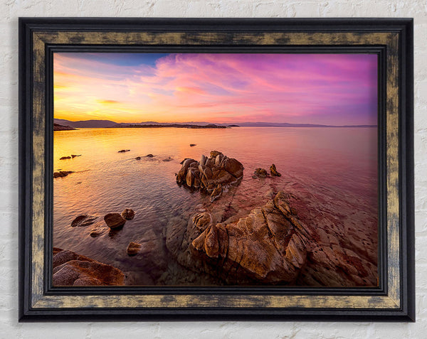 Pink Skies Over The Ocean Rocks Framed Print