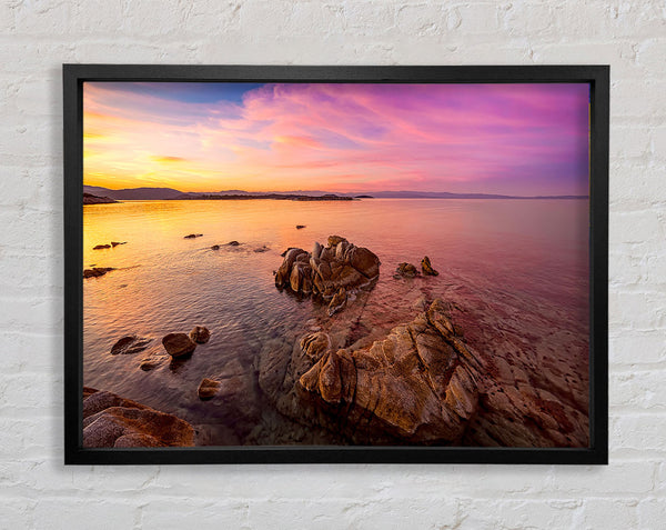 Pink Skies Over The Ocean Rocks Framed Print