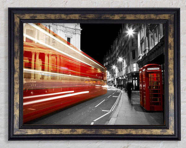 Red Bus Speeding Through The City Framed Print