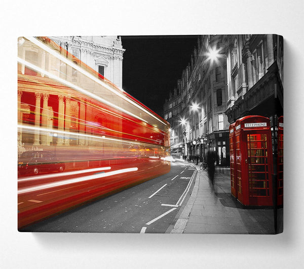 Red Bus Speeding Through The City Canvas Wall Art