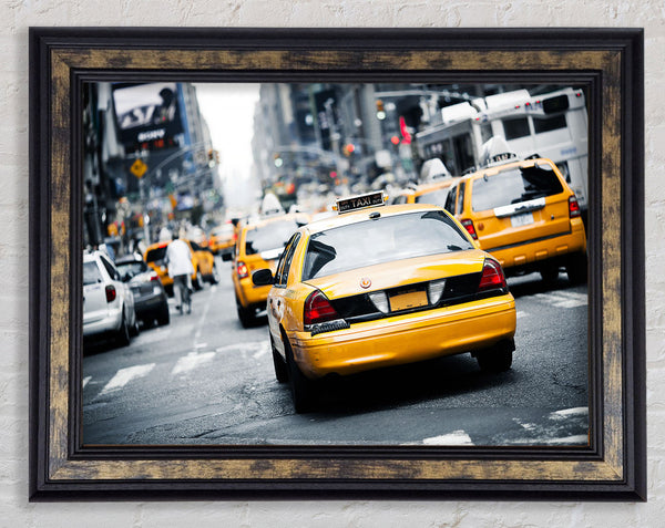 Yellow Taxis On The City Streets Framed Print