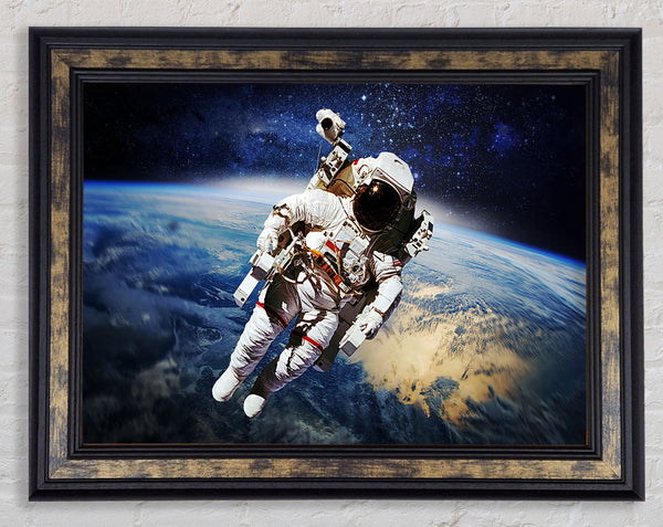 Astronaut Above The Earth Framed Print