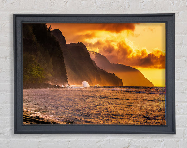 Cliff sunset crashing ocean Framed Print