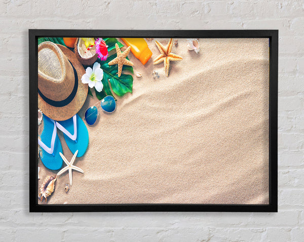 Sunglasses and hat on the beach Framed Print