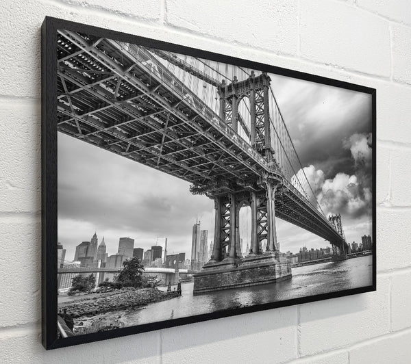 NYC black and white bridge under clouds