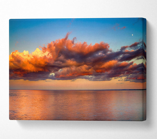  A Canvas Print of Red glowing clouds above the sea Canvas Print