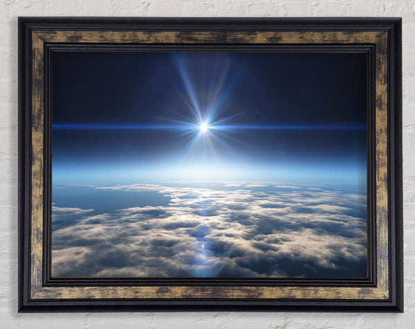 The sun above the clouds and atmostphere Framed Print