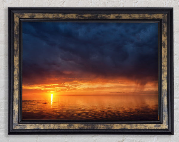Storms arriving over the sunset Framed Print