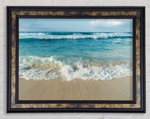 Crashing waves on the sandy beach Framed Print
