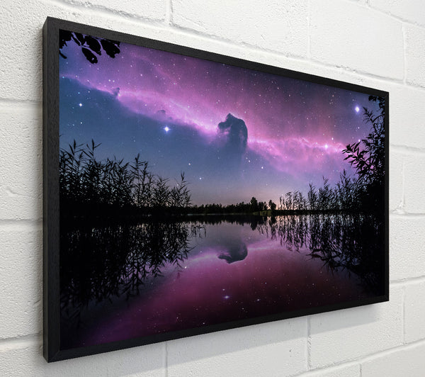 Horse head nebula over a purple lake