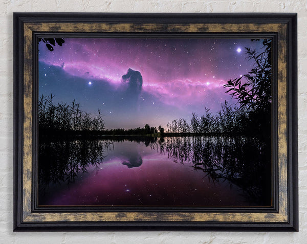 Horse head nebula over a purple lake Framed Print