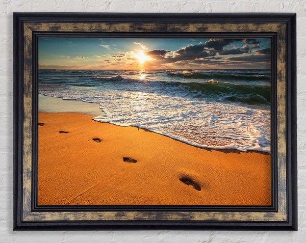 Footprints on the beach Framed Print