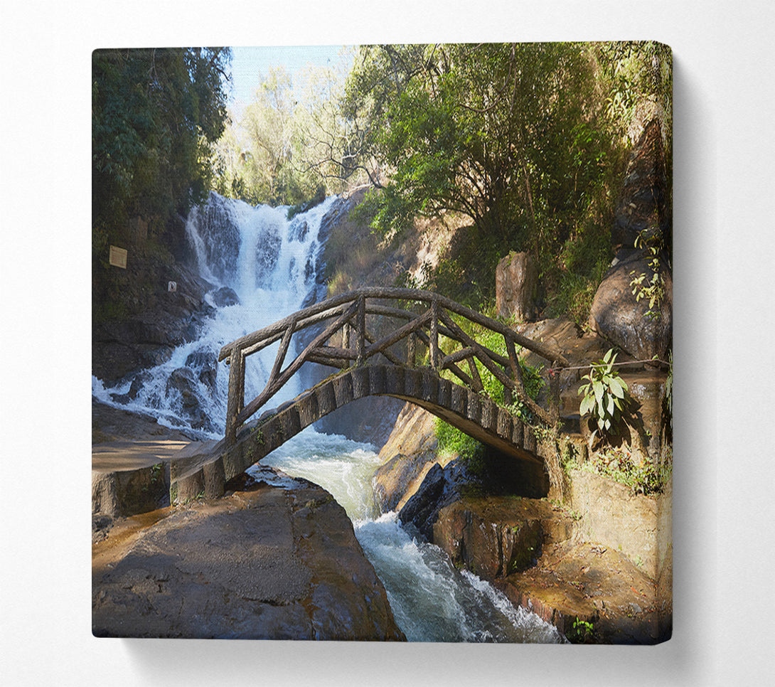  A Canvas Print of Rustic made bridge by a waterfall Canvas Print