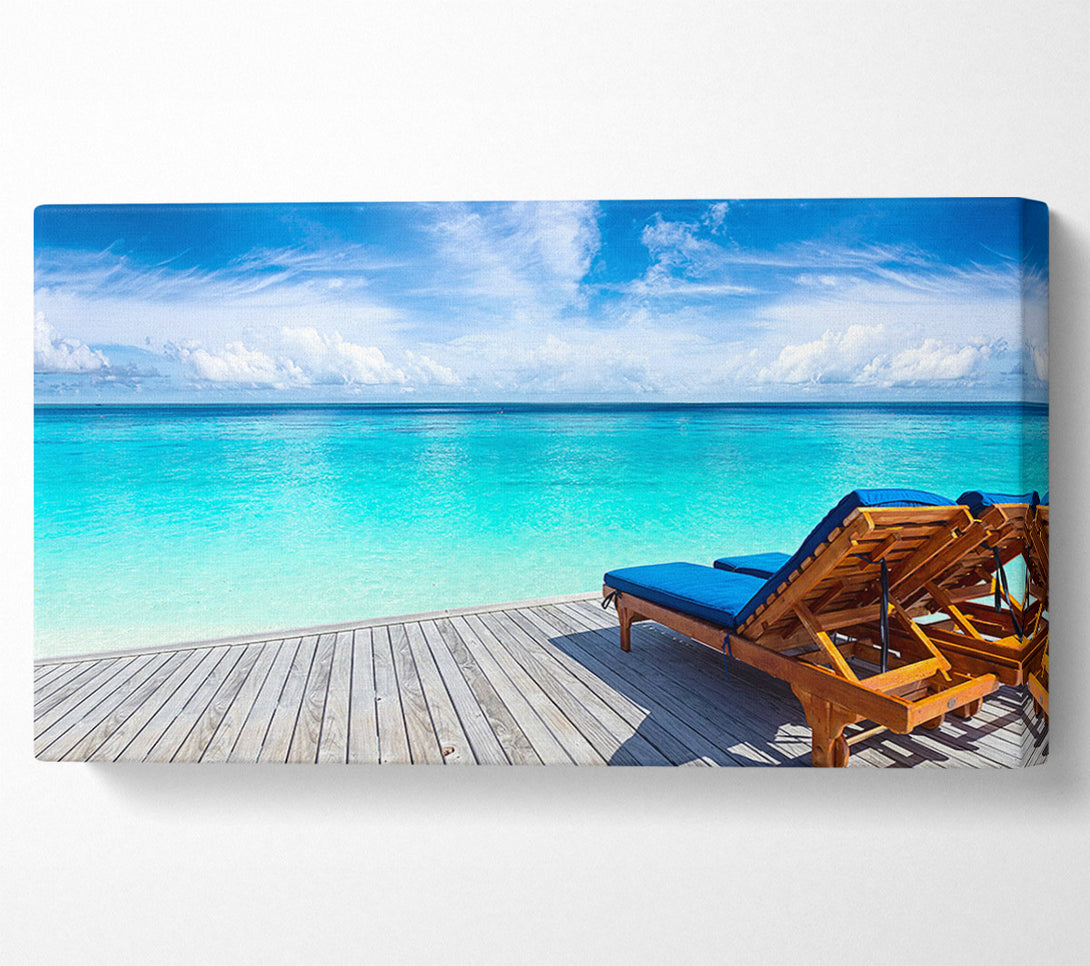  A Canvas Print of sunchairs on decking on the beach Canvas Wall Art