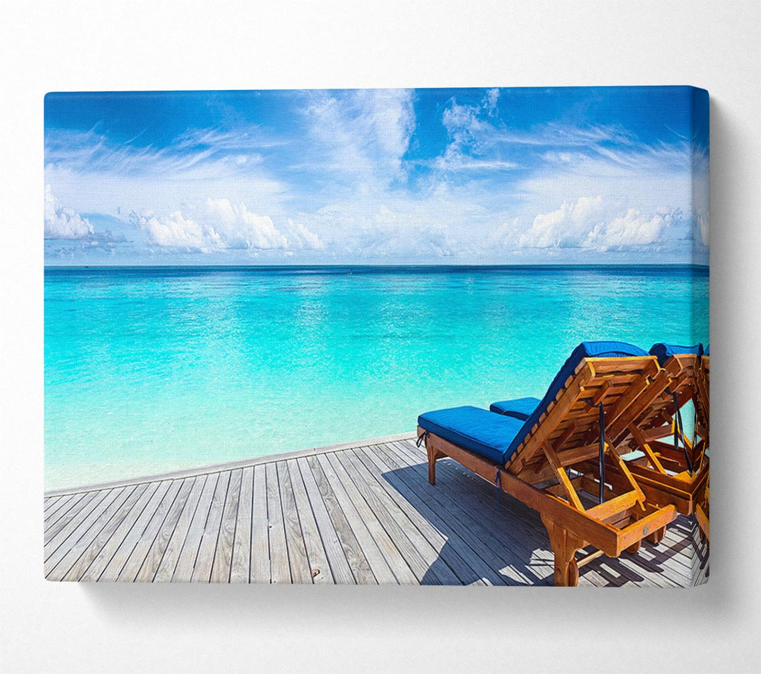  A Canvas Print of sunchairs on decking on the beach Canvas Wall Art