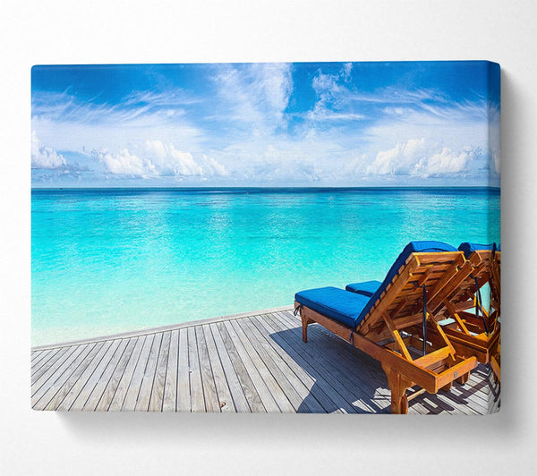  A Canvas Print of sunchairs on decking on the beach Canvas Wall Art