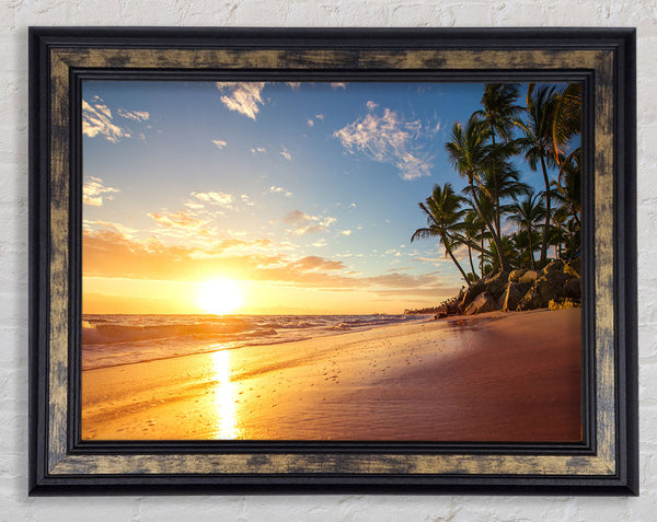 Sunset on the beach sand Framed Print
