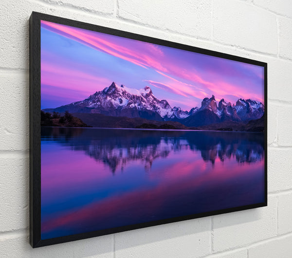 Purple and blue mountains above lake