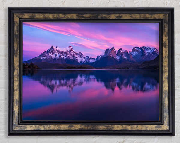 Purple and blue mountains above lake Framed Print