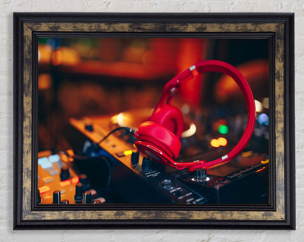 Red headphones on mixing desk Framed Print