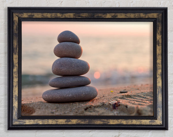 Zen stones stacked up on beach Framed Print