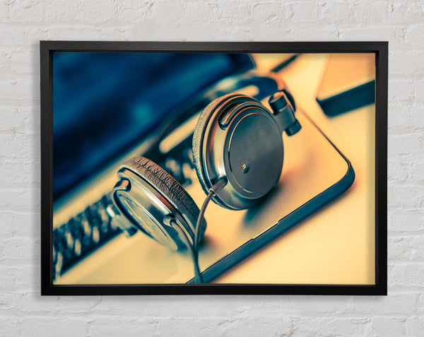 headpgones on the table Framed Print